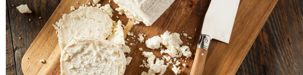 Goat cheese on cutting board