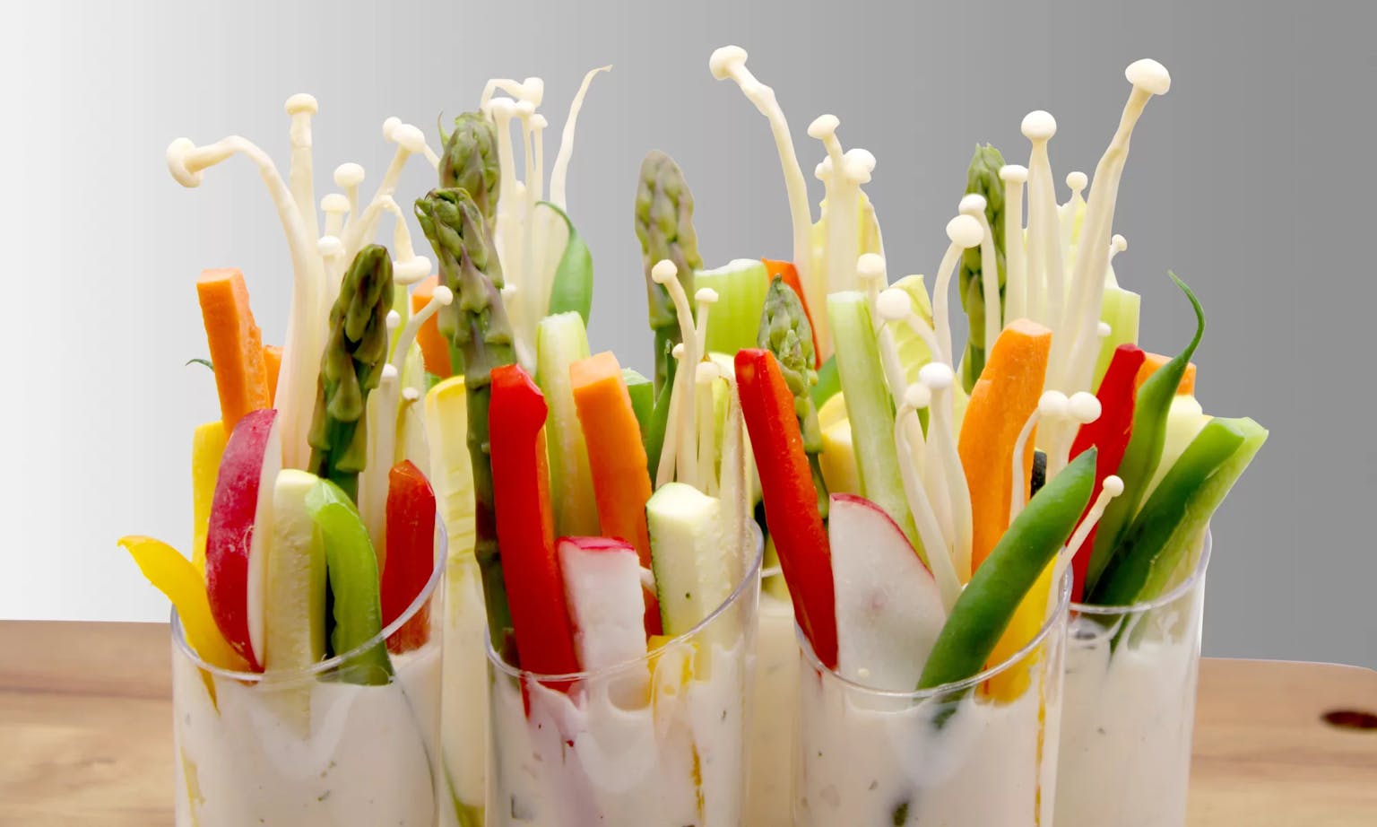 These crunchy cups will please your palate and catch the eye of discerning guests. Sticks of carrot, celery, pepper, and squash, garnished with endive. Includes your choice of ranch or blue cheese dressing. Includes 12 cups.