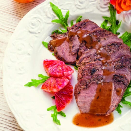 Duck Breast with Pluot Sauce over Arugula