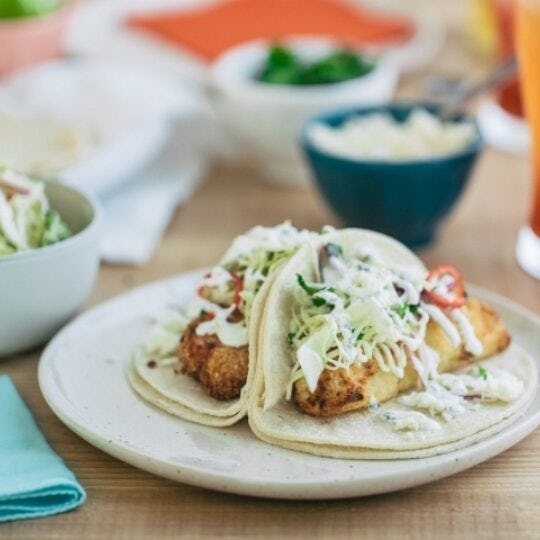Air Fryer Fish Tacos with Cilantro Slaw and Lime Crema