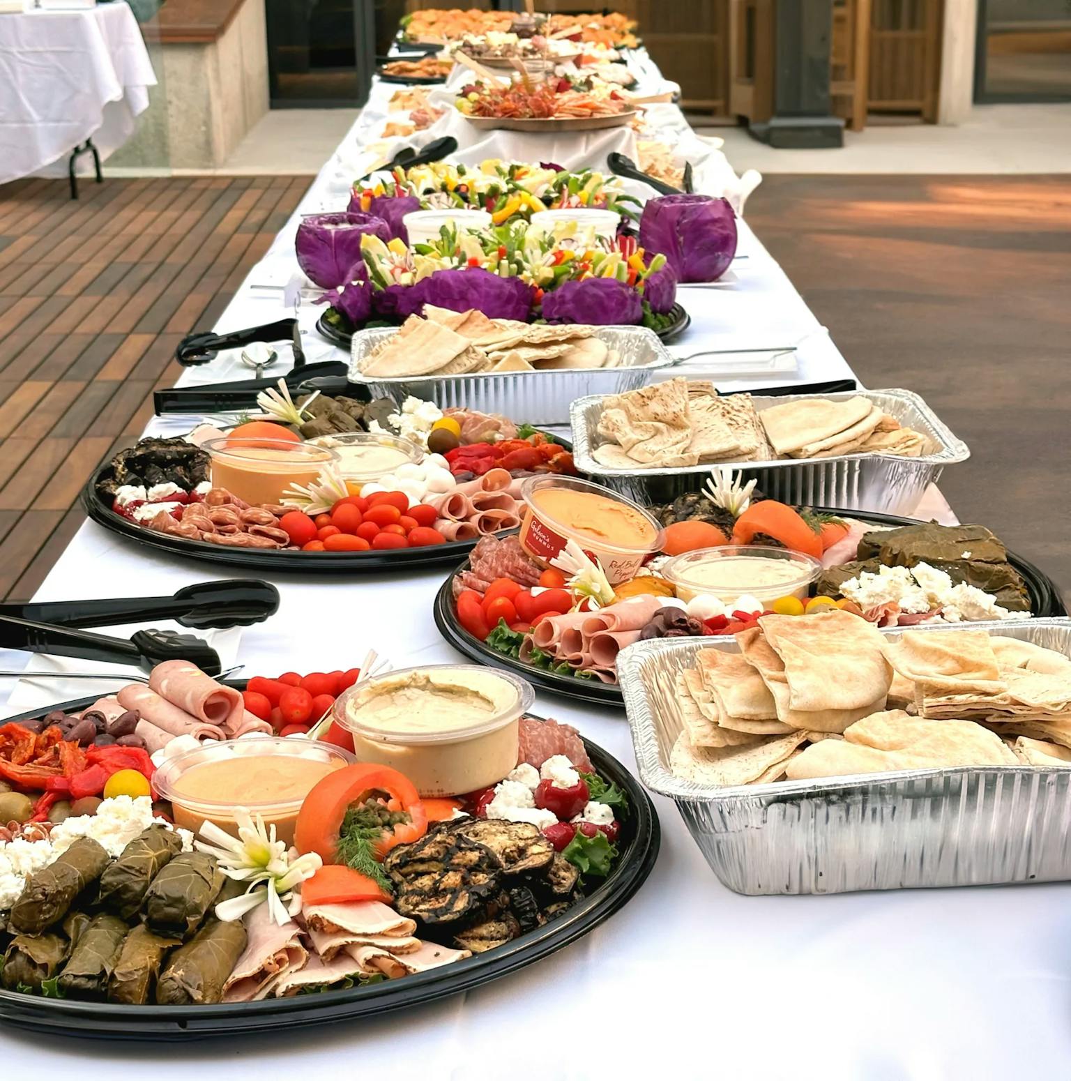 catering platters on table with white linen