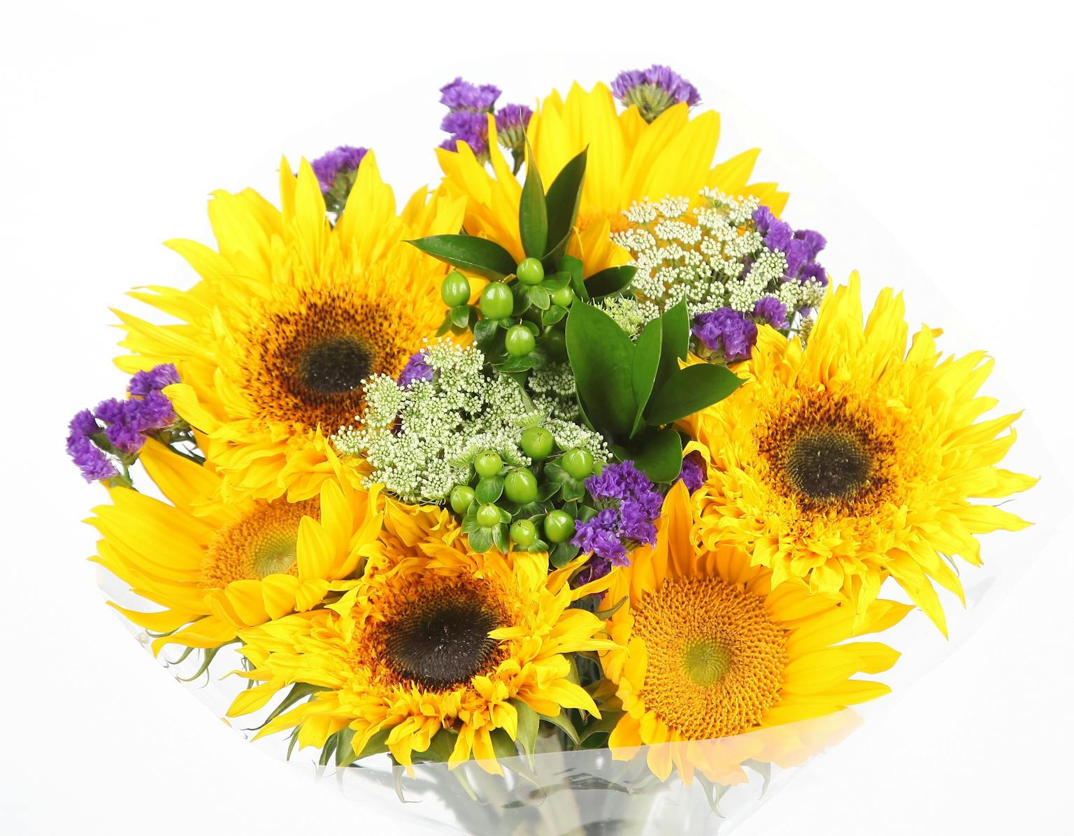 beautiful arrangement of yellow sunflowers and purple flowers with green leaves