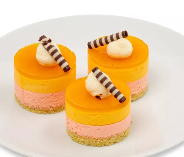 Tropical passion fruit and blood orange mousse over salted toasted pepita sponge cake. Includes 6 pieces.